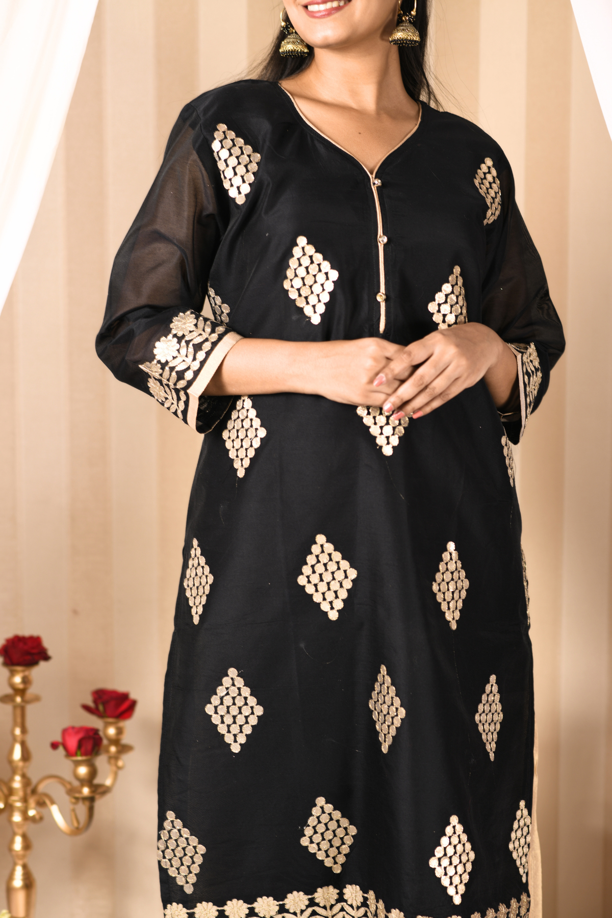 golden sharara and a black kurti