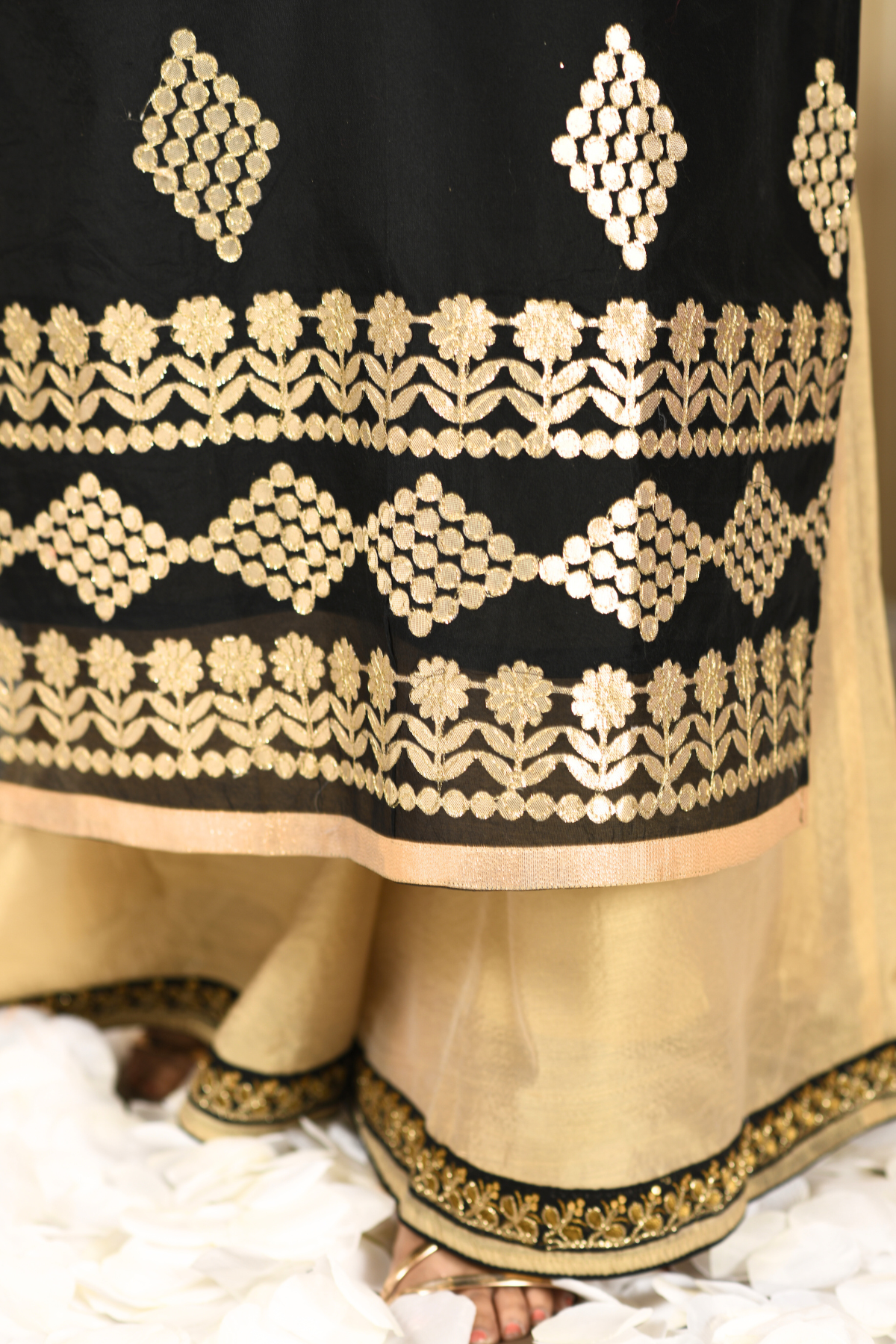 golden sharara and a black kurti set